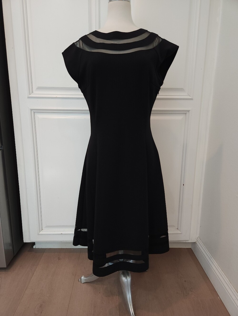 Elegant Black Fit-and-Flare Dress with Sheer Insets